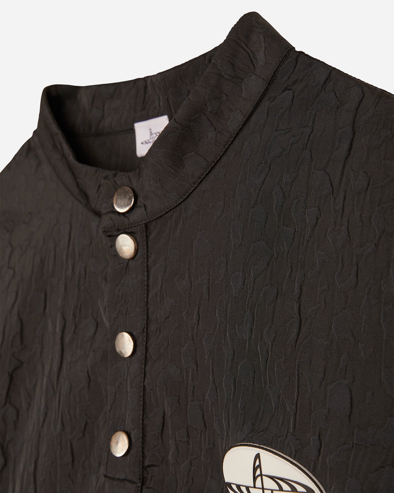 Noskra Dragon-Skin Polo tecnica bottoni automatici